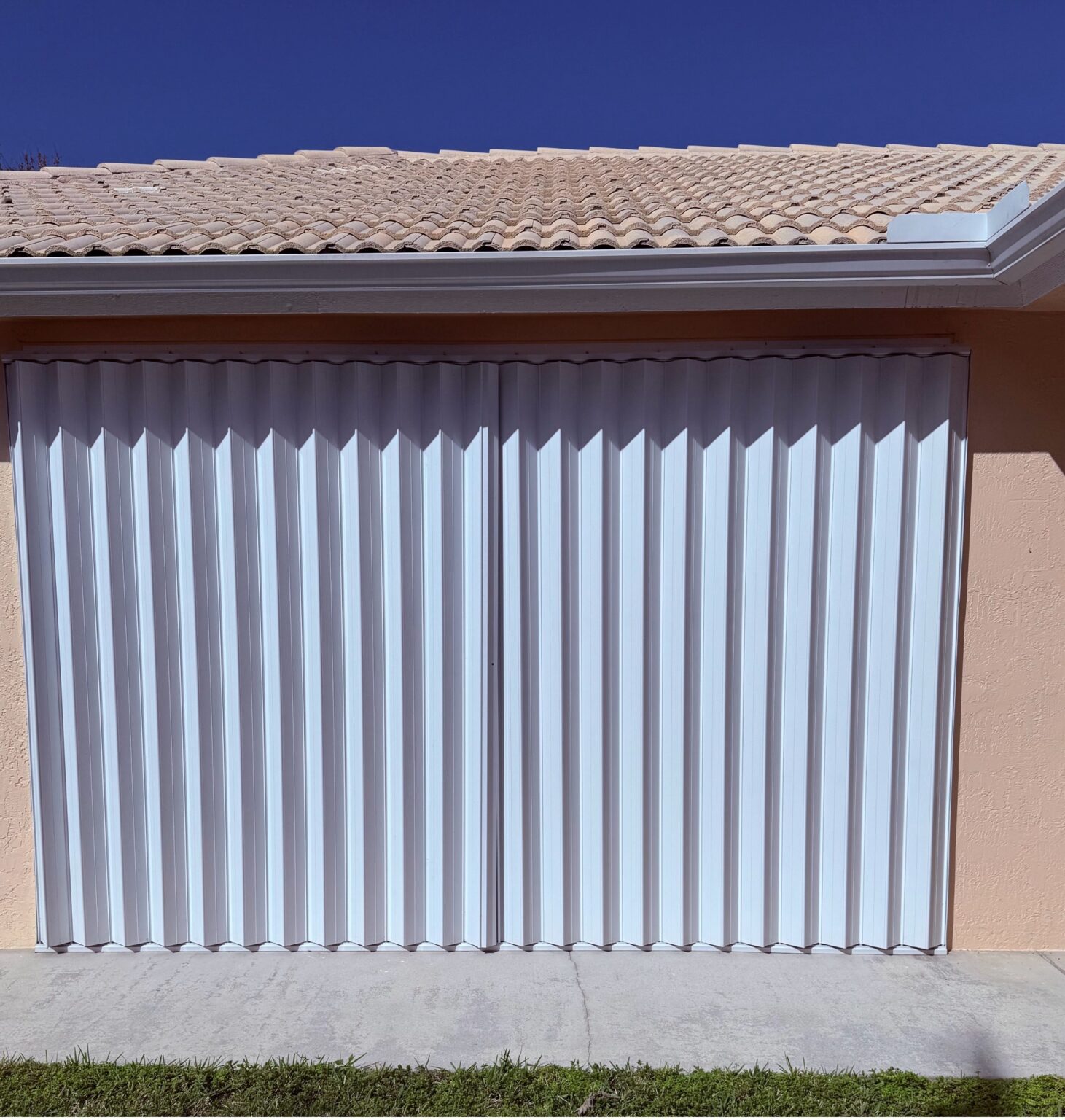 Accordion Shutters in the backyard of a South Florida home.